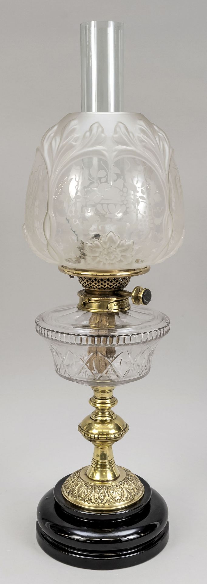 Petroleum lamp, 19th/20th c., black glazed ceramic base, balustrated brass stem, glass tank with cut