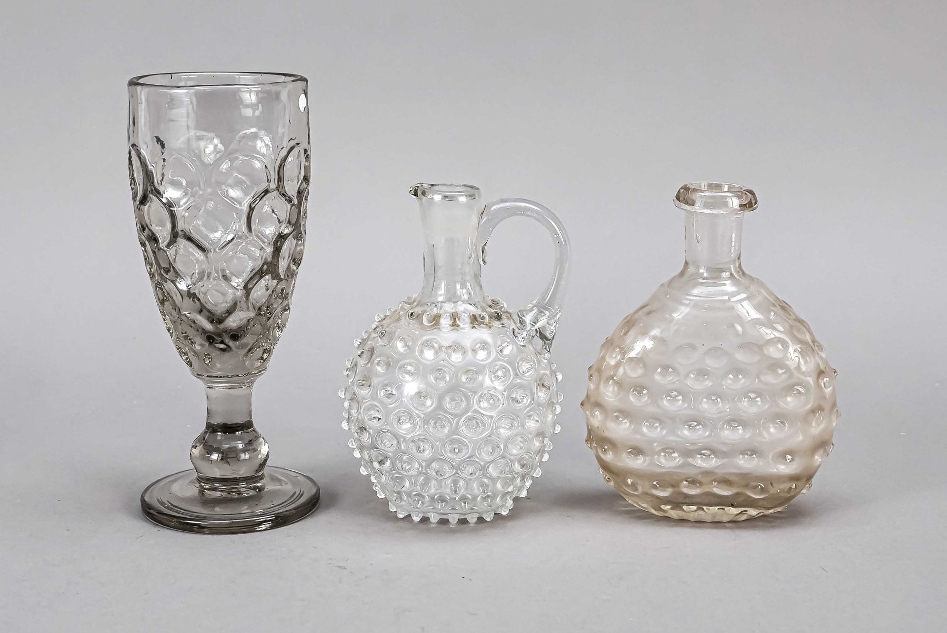 Group of three pieces, 19th century, 2 flacons and a foot glass, each clear glass, with break-off,