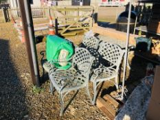 A DECORATIVE ALUMINIUM PATIO TABLE AND FOUR CHAIRS WITH CUSHIONS PLUS DECORATIVE CAST IRON PARASOL