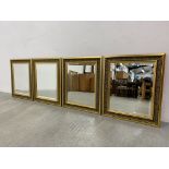 FOUR MATCHING ORNATE GILT FRAMED BEVELLED WALL MIRRORS EACH W 55CM. H 66CM.