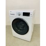 A HAIER DIRECT MOTION WASHING MACHINE MODEL HW80-B1439 - SOLD AS SEEN