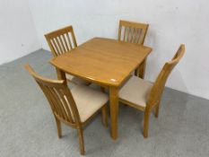 A MODERN BEECHWOOD DINING SET COMPRISING EXTENDING DINING TABLE AND FOUR DINING CHAIRS (TABLE 90 X