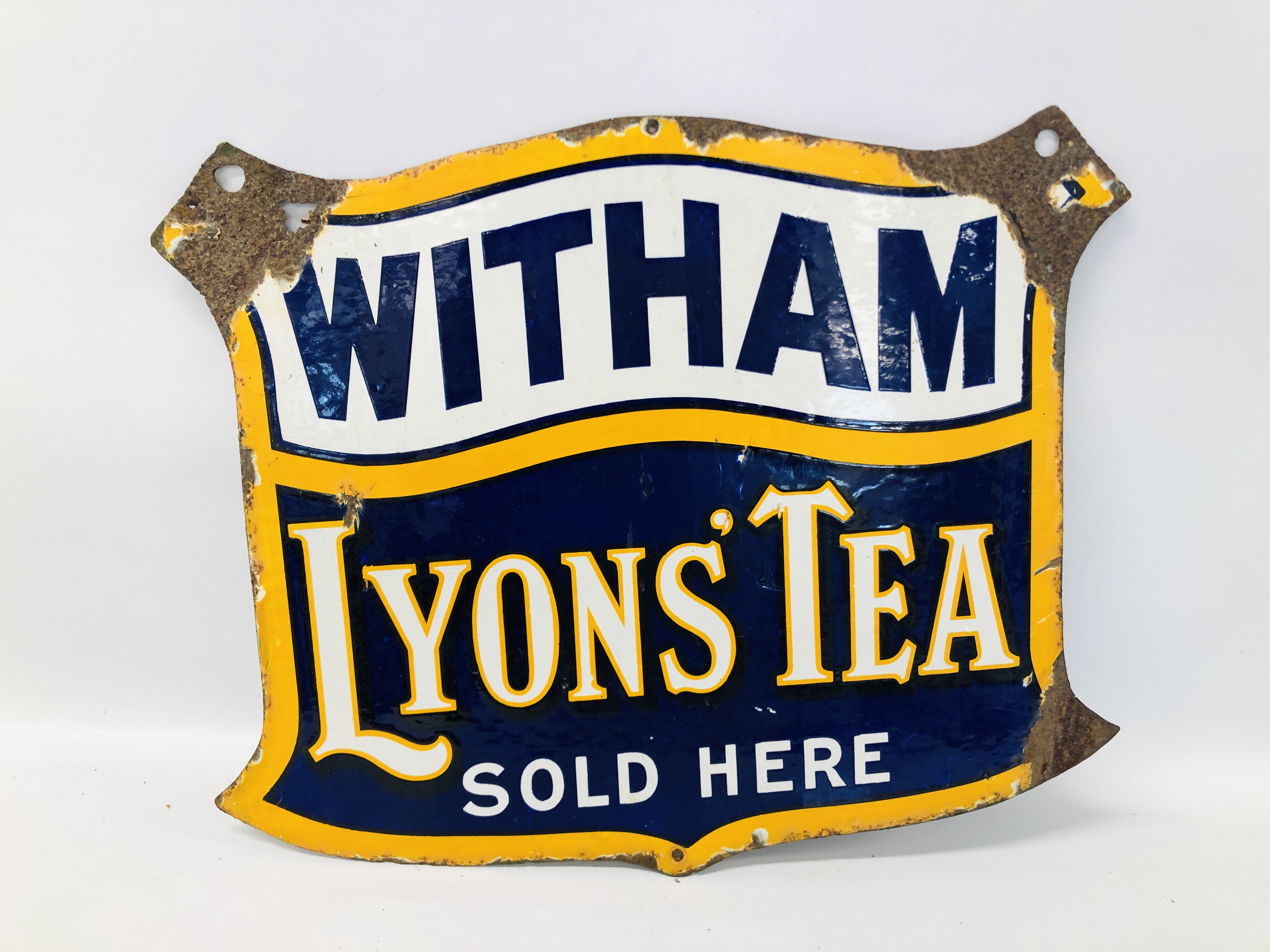 A VINTAGE "WITHAM LYONS' TEA SOLD HERE" ENAMEL ADVERTISING SIGN - W 56CM. H 46CM.