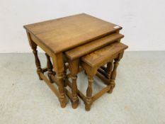 A NEST OF THREE OAK GRADUATED OCCASIONAL TABLES