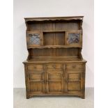 A GOOD QUALITY REPRODUCTION OAK DRESSER - W 137CM. D 44CM. H 183CM.