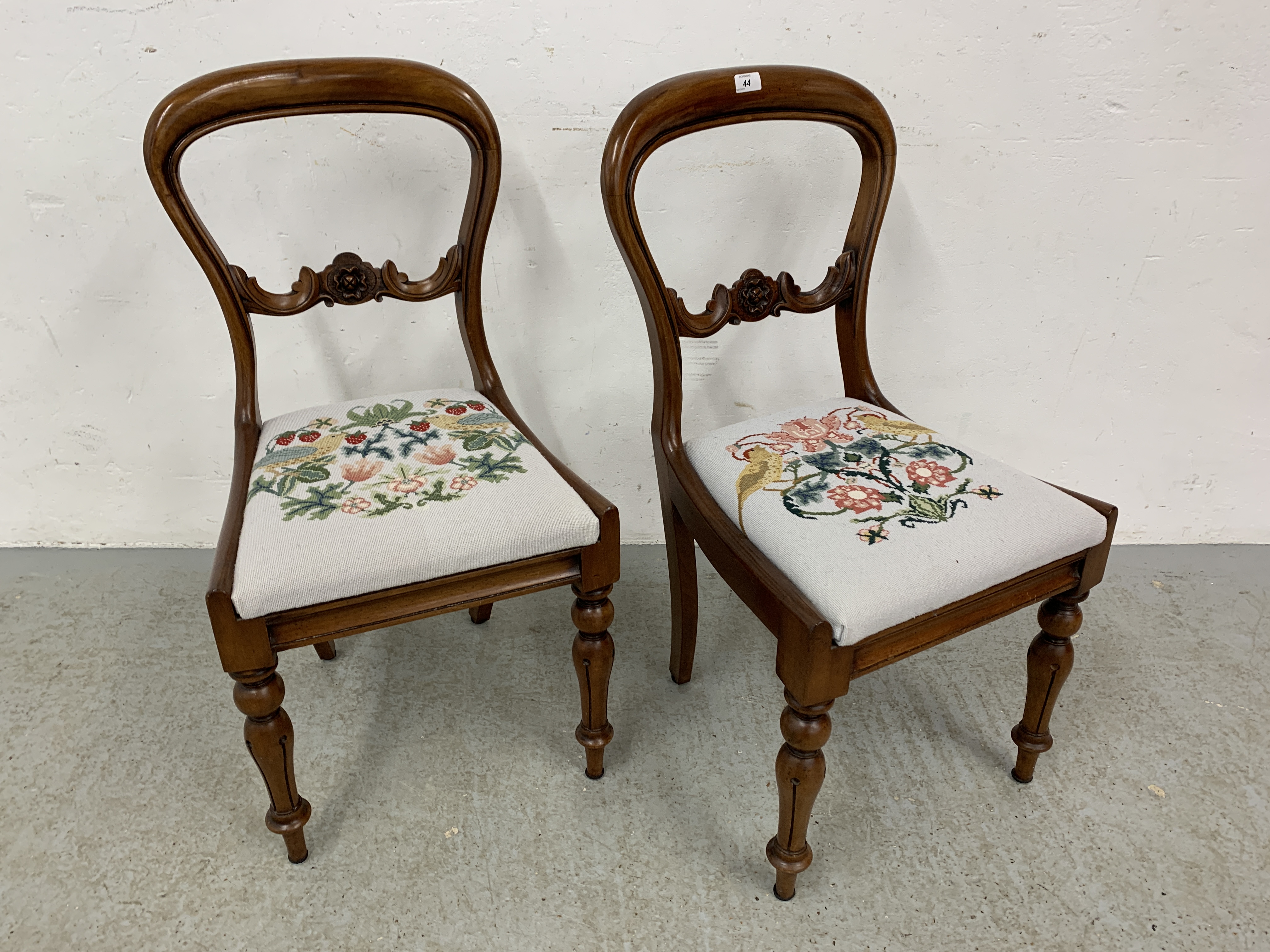 A PAIR OF VICTORIAN SIDE CHAIRS WITH HAND EMBROIDERED DROP IN SEATS.