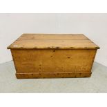 AN ANTIQUE WAXED PINE BLANKET BOX - W 95CM. D 52CM. H 43CM.