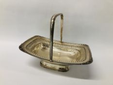 AN EDWARD BARNARD AND SONS LTD LONDON SILVER FOOTED BASKET WITH HANDLE AND SCROLLED EDGE DESIGN -