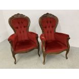 A PAIR OF REPRODUCTION CRIMSON VELOUR UPHOLSTERED BUTTON BACK ELBOW CHAIRS.