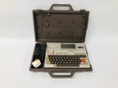 A VINTAGE EPSON HX-20 PORTABLE COMPUTER WITH POWER PACK IN ORIGINAL PLASTIC TRANSIT CASE - SOLD AS