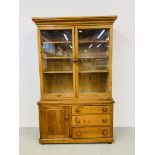 AN ANTIQUE PINE GLAZED TOP DRESSER - W 118CM. D 45CM. OVERALL HEIGHT 193CM.