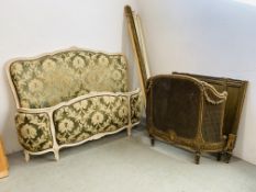 AN ORNATE CONTINENTAL STYLE CREAM FINISH DOUBLE BEDSTEAD WITH BROCADE UPHOLSTERED HEAD AND