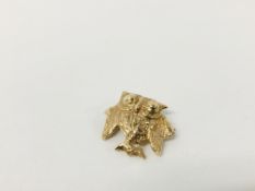 A 9CT GOLD OWL BROOCH