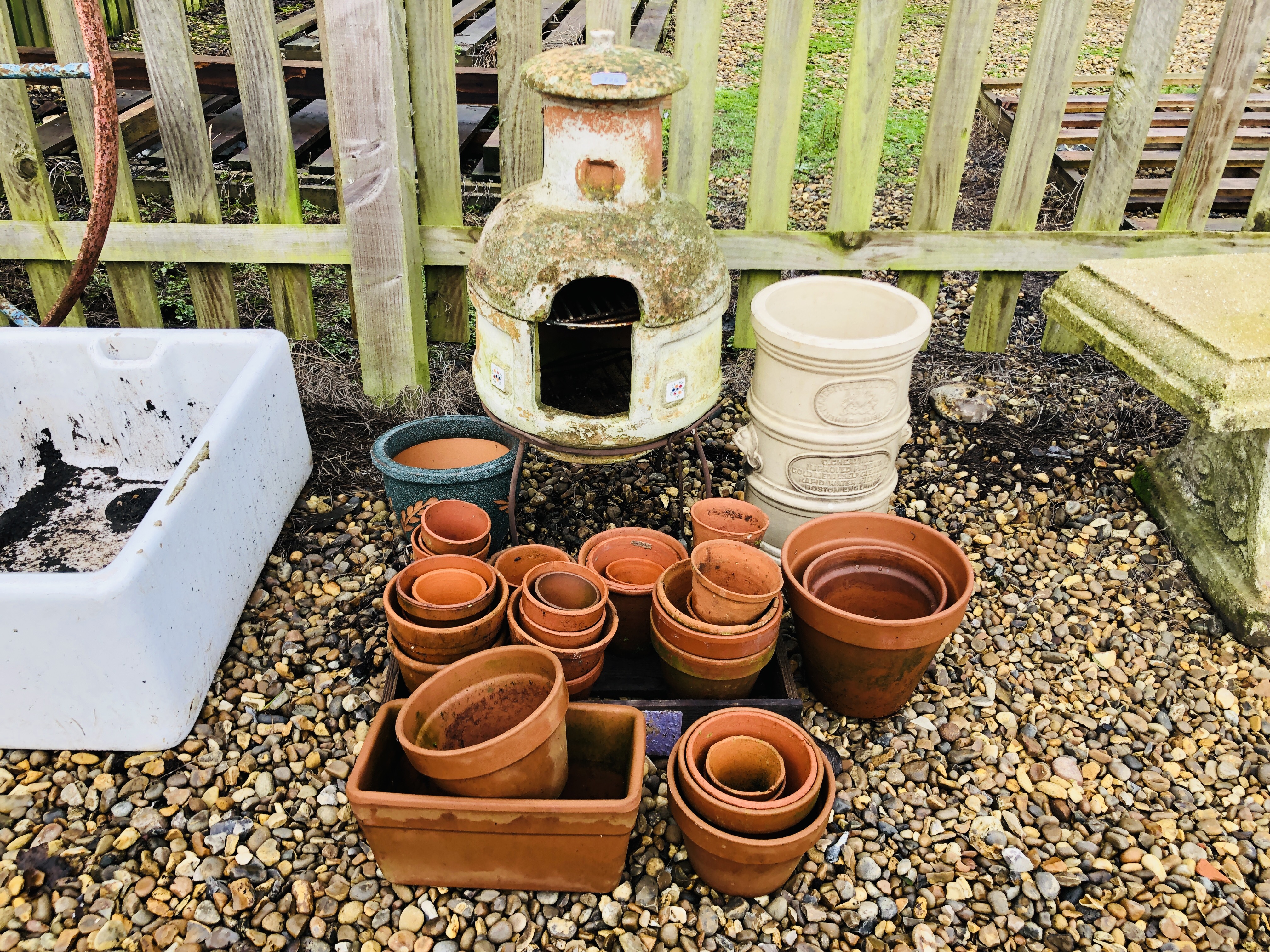 A SMALL TERRACOTTA GARDEN CHIMINEA,