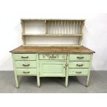 A RUSTIC PINE SHABBY CHIC SEVEN DRAWER DRESSER BASE WITH ASSOCIATED PAINTED PINE PLATE RACK,