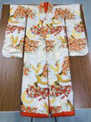 A JAPANESE WEDDING SILK KIMONO OF ORANGE AND GREEN DESIGN DEPICTING CRANES