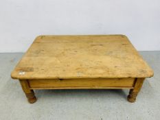 A RUSTIC WAXED PINE COFFEE TABLE, W 75CM, L 107CM, H 36CM.