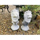 PAIR OF CONCRETE LION ORNAMENTS.