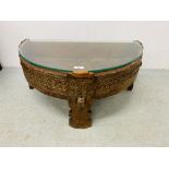 A HARDWOOD EASTERN HALF MOON COFFEE TABLE WITH GLASS TOP