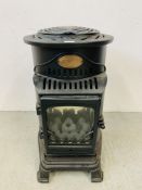 A PROVENCE CAST IRON BOTTLE GAS ROOM HEATER