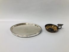 A SILVER WINE TASTER WITH GRAPE LEAF DESIGN HANDLE ALONG WITH AN OVAL SILVER COVERED COASTER