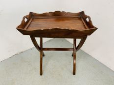 A MAHOGANY 2 HANDLED TRAY ON FOLDING STAND