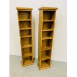 A PAIR OF OAK CD MEDIA STORAGE TOWERS - W 26CM. D 17CM. H 116CM.