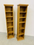 A PAIR OF OAK CD MEDIA STORAGE TOWERS - W 26CM. D 17CM. H 116CM.