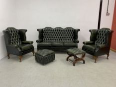 A SUITE OF TRADITIONAL BOTTLE GREEN LEATHER BUTTON BACK LOUNGE FURNITURE COMPRISING PAIR WING BACK