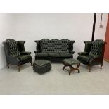 A SUITE OF TRADITIONAL BOTTLE GREEN LEATHER BUTTON BACK LOUNGE FURNITURE COMPRISING PAIR WING BACK