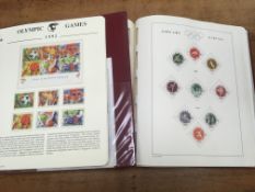 OLYMPIC GAMES THEMATIC STAMP COLLECTION IN TWO ALBUMS,