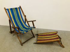 A HARDWOOD SLING FOLDING DECK CHAIR WITH STRIPED FINISH (ARM RESTS - A/F)