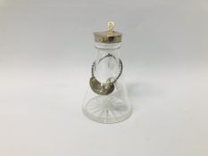 A GLASS CRUET OF CONICAL FORM WITH SILVER MOUNT, ALONG WITH A WHISKEY LABEL, LONDON 1921 - H 11CM.