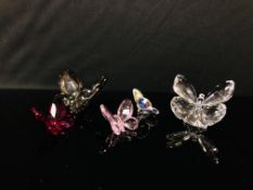 A COLLECTION OF FIVE SWAROVSKI BUTTERFLIES OF VARIOUS COLOURS INCLUDING SMOKEY, PINK, PURPLE,