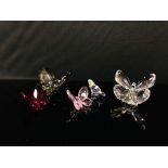 A COLLECTION OF FIVE SWAROVSKI BUTTERFLIES OF VARIOUS COLOURS INCLUDING SMOKEY, PINK, PURPLE,