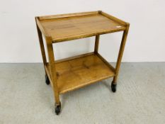 A HARDWOOD TWO TIER TROLLEY W 63CM. D 43CM. H 72CM.