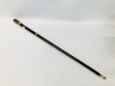 A BRASS MOUNTED WALKING STICK, THE HANDLE IN THE FORM OF A BEAR, OPENING ON A FITTED INTERIOR.