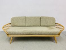 AN ERCOL BLONDE DAY BED.