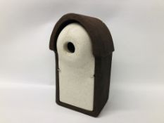 A WOODSTONE BIRD BOX H 40CM. W 20CM. D 16CM.