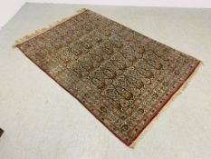 PERSIAN RUG WITH INTERLOCKING OGEE DESIGNS ON AN IVORY FIELD WITH PALMATES & BIRDS,