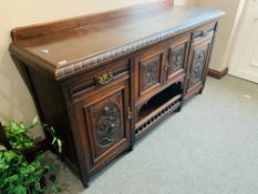 A VICTORIAN MAHOGANY SIDEBOARD WITH CARVED PANEL DETAIL - W 185CM. D 60CM. H 96CM.