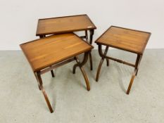 A NEST OF THREE GRADUATED MODERN YEW WOOD OCCASIONAL TABLES