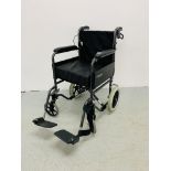 A ROMA MEDICAL FOLDING WHEEL CHAIR COMPLETE WITH FOOT RESTS AND SEAT CUSHION.