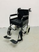 A ROMA MEDICAL FOLDING WHEEL CHAIR COMPLETE WITH FOOT RESTS AND SEAT CUSHION.