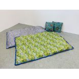 TWO SMALL SATIN BED THROWS AND A PAIR OF TURQUOISE PATTERNED TASSELLED CUSHIONS.