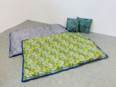 TWO SMALL SATIN BED THROWS AND A PAIR OF TURQUOISE PATTERNED TASSELLED CUSHIONS.