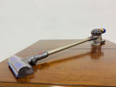 A DYSON V8 ANIMAL CORDLESS VACUUM CLEANER - NO CHARGER - SOLD AS SEEN.