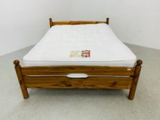 A SOLID HONEY PINE DOUBLE BEDSTEAD WITH BRITISH BED COMPANY "THE YORK" HAND MADE MATTRESS.