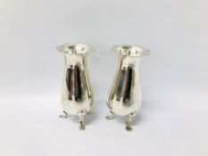 A PAIR OF VICTORIAN SILVER VASES OF BALASTER FORM, FLARED RIMS ON TRIPOD SUPPORTS LONDON 1897,