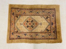 AN UNUSUAL ORIENTAL RUG WITH CENTRAL LOZENGE ON A BROWN FIELD DIVIDED BY A GEOMETRIC DESIGN,